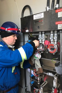 contro Valve technician working on an integrated panel