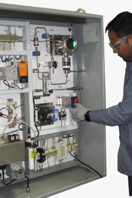 contro Valve technician looking an integrated panel
